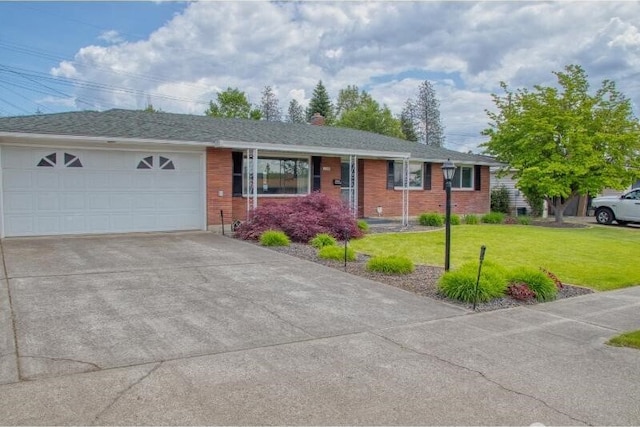 5516 N Fleming St, Spokane, WA 99205 - ranch-style house featuring driveway, a garage, a front yard, and brick siding