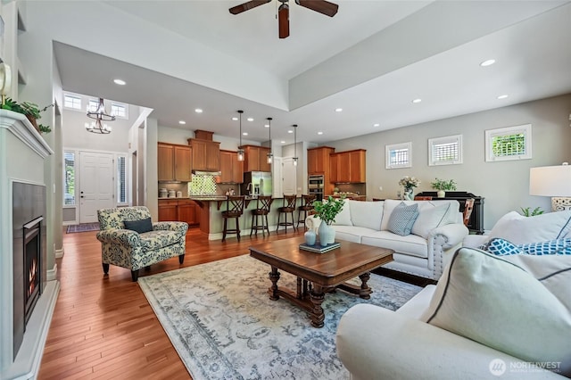 13310 239th Way NE, Redmond, WA 98053 - living area with recessed lighting, light wood-style floors, healthy amount of natural light, and a ceiling fan