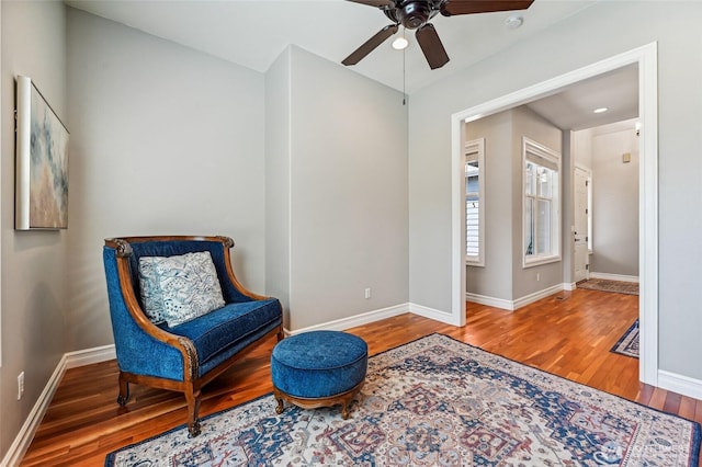 13310 239th Way NE, Redmond, WA 98053 - living area with a ceiling fan, wood finished floors, and baseboards