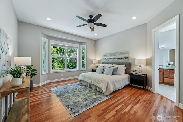 13310 239th Way NE, Redmond, WA 98053 - bedroom with wood finished floors, baseboards, a ceiling fan, and recessed lighting