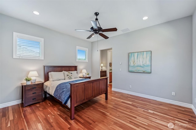 13310 239th Way NE, Redmond, WA 98053 - bedroom with wood finished floors, baseboards, recessed lighting, and ceiling fan