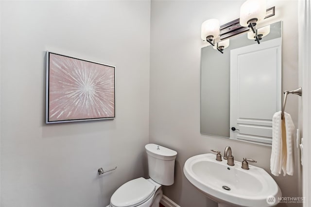 13310 239th Way NE, Redmond, WA 98053 - bathroom featuring a sink, toilet, and baseboards