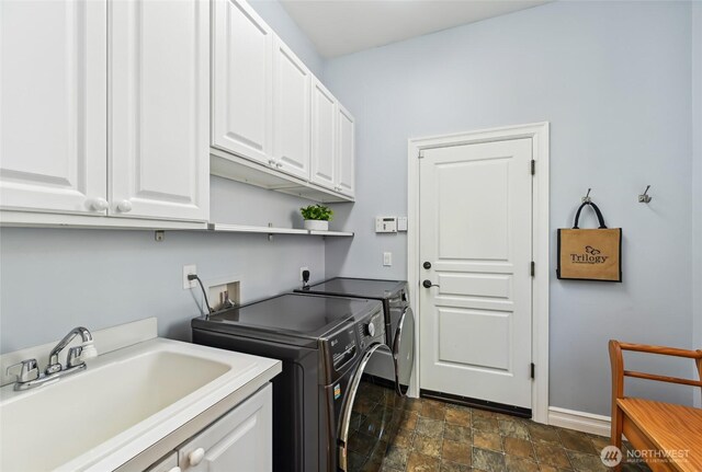 13310 239th Way NE, Redmond, WA 98053 - washroom with cabinet space, independent washer and dryer, stone finish flooring, and baseboards