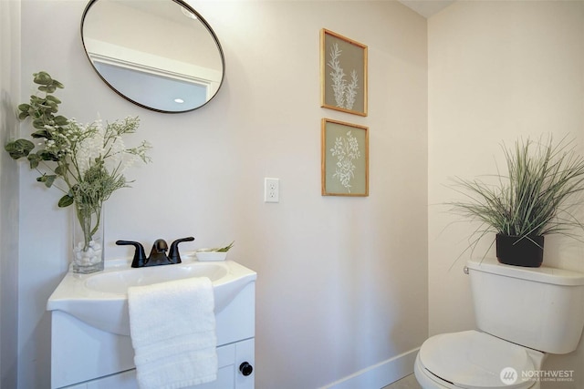 306 3rd St, Sultan, WA 98294 - half bathroom with toilet, baseboards, and vanity