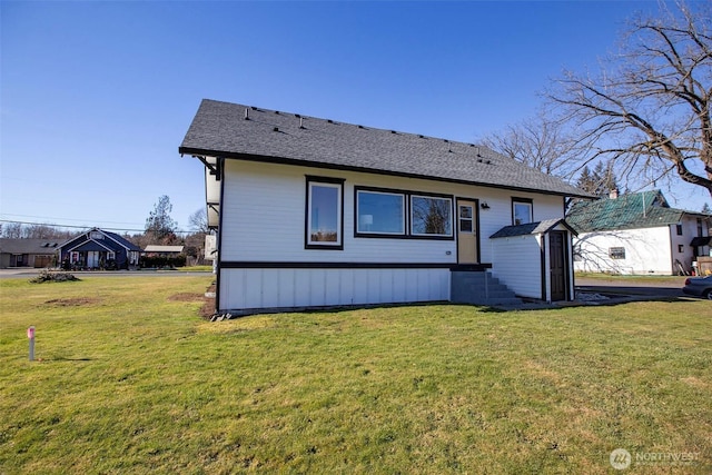 306 3rd St, Sultan, WA 98294 - back of house with a yard and a shingled roof