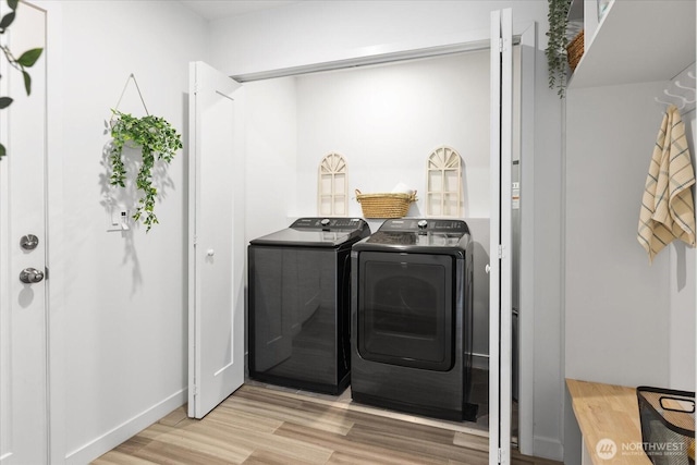 25 140th St SW, Everett, WA 98208 - laundry room featuring washer and clothes dryer and wood finished floors