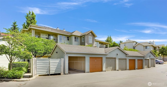15026 40th Ave W Unit 13-104, Lynnwood, WA 98087 - multi unit property featuring community garages, roof with shingles, and a residential view