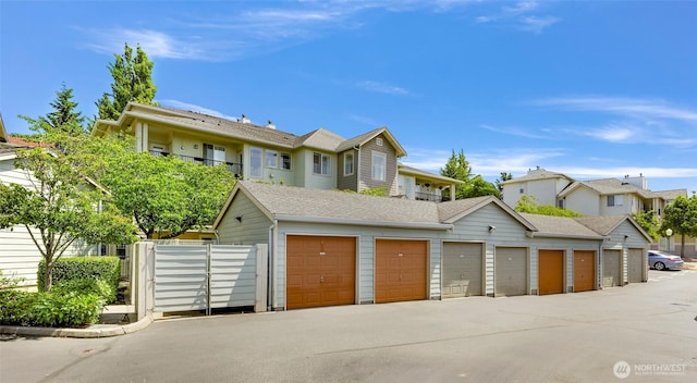 15026 40th Ave W Unit 13-104, Lynnwood, WA 98087 - townhome / multi-family property featuring community garages and roof with shingles
