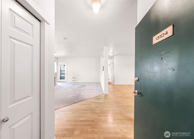 15026 40th Ave W Unit 13-104, Lynnwood, WA 98087 - hall featuring light wood-style floors