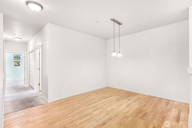 15026 40th Ave W Unit 13-104, Lynnwood, WA 98087 - unfurnished room with light wood-type flooring and baseboards