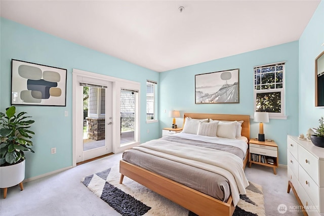 15026 40th Ave W Unit 13-104, Lynnwood, WA 98087 - bedroom featuring access to outside and light carpet