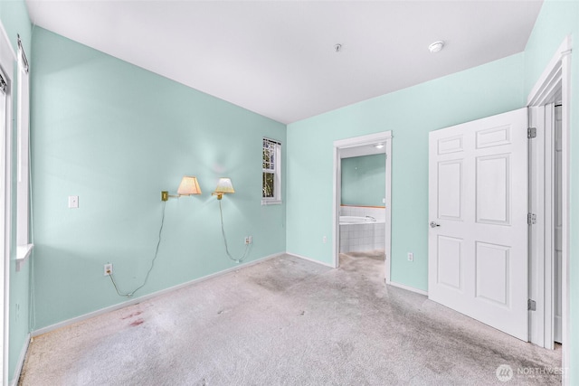 15026 40th Ave W Unit 13-104, Lynnwood, WA 98087 - unfurnished bedroom with carpet flooring and connected bathroom