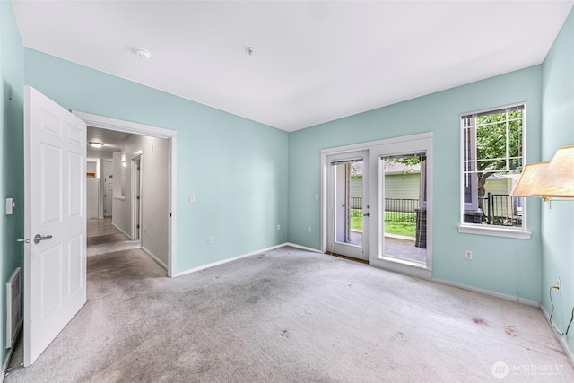 15026 40th Ave W Unit 13-104, Lynnwood, WA 98087 - carpeted empty room with a smoke detector and baseboards