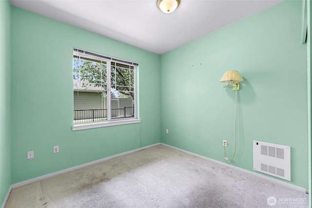 15026 40th Ave W Unit 13-104, Lynnwood, WA 98087 - spare room with carpet floors and radiator
