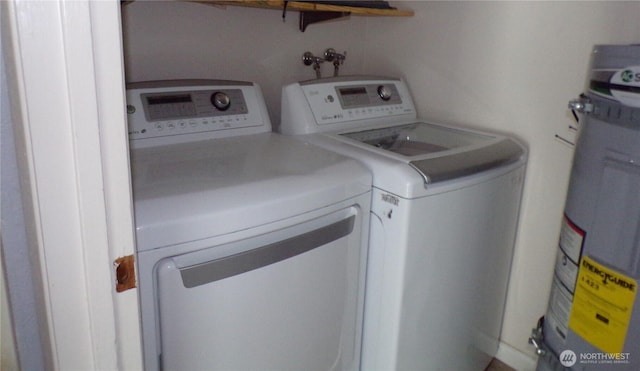 2020 SW 318th Pl Unit C3, Federal Way, WA 98023 - laundry area featuring electric water heater and washing machine and clothes dryer