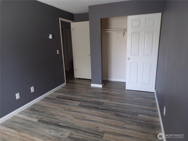 2020 SW 318th Pl Unit C3, Federal Way, WA 98023 - unfurnished bedroom featuring baseboards, wood finished floors, and a closet