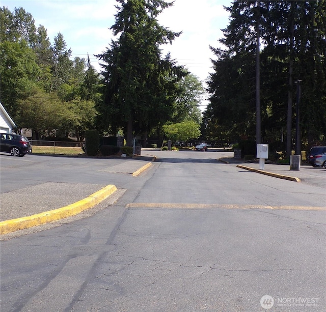 2020 SW 318th Pl Unit C3, Federal Way, WA 98023 - view of asphalt road featuring curbs