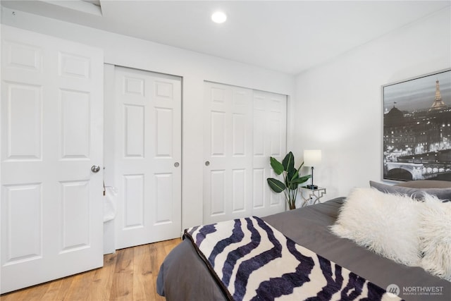 920 S 73rd St, Tacoma, WA 98408 - bedroom with light wood-style flooring, multiple closets, and recessed lighting