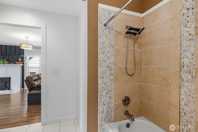 212 N Michigan St, Aberdeen, WA 98520 - full bath featuring bathing tub / shower combination, tile patterned floors, a fireplace, and baseboards