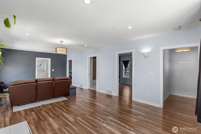 212 N Michigan St, Aberdeen, WA 98520 - unfurnished living room featuring wood finished floors, recessed lighting, and baseboards