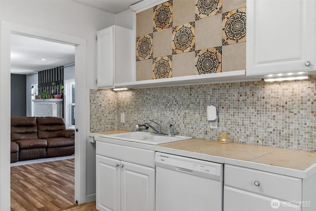 212 N Michigan St, Aberdeen, WA 98520 - kitchen featuring dishwasher, a sink, light countertops, and white cabinets