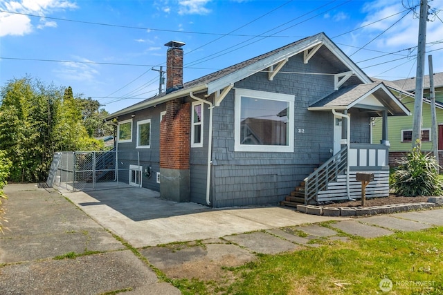 212 N Michigan St, Aberdeen, WA 98520 - view of front of home featuring a chimney and a gate