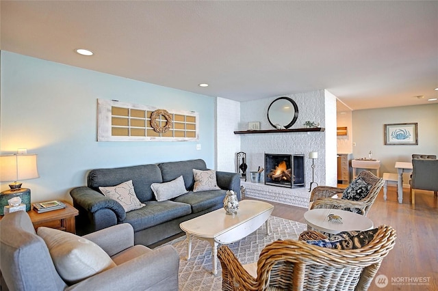 987 Cavalero Rd, Camano Island, WA 98282 - living room featuring wood finished floors, a fireplace, and recessed lighting