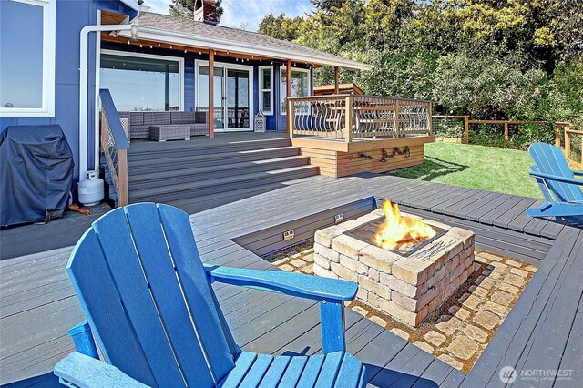 987 Cavalero Rd, Camano Island, WA 98282 - deck featuring a fire pit and french doors