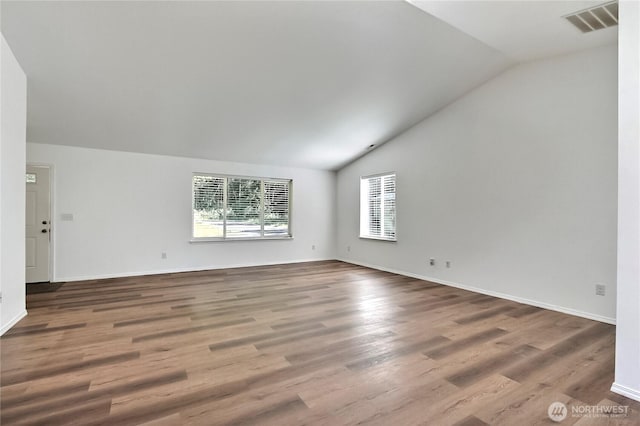 250 Hewitt Rd Unit 23, Chehalis, WA 98532 - empty room with lofted ceiling, wood finished floors, and baseboards