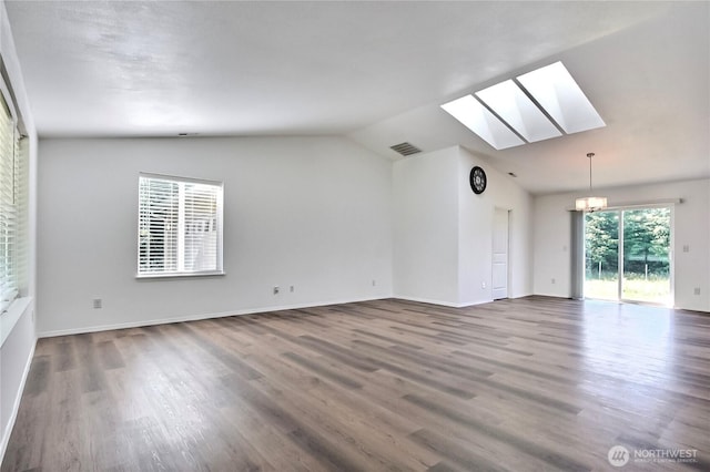 250 Hewitt Rd Unit 23, Chehalis, WA 98532 - unfurnished room featuring a skylight, lofted ceiling, wood finished floors, a chandelier, and baseboards