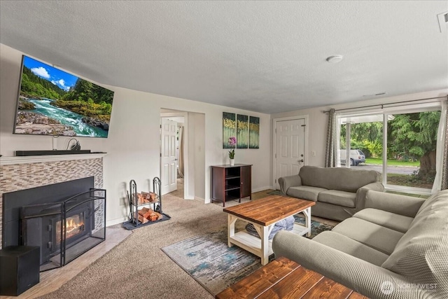 1412 Mcmillan Ave, Sumner, WA 98390 - carpeted living area featuring a textured ceiling, baseboards, and a tile fireplace