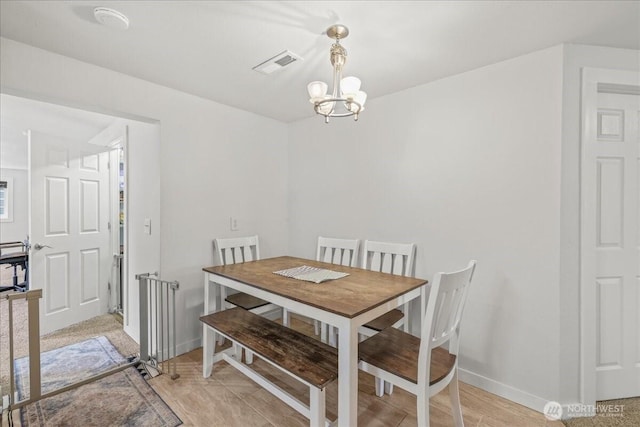 1412 Mcmillan Ave, Sumner, WA 98390 - dining room with a chandelier and baseboards