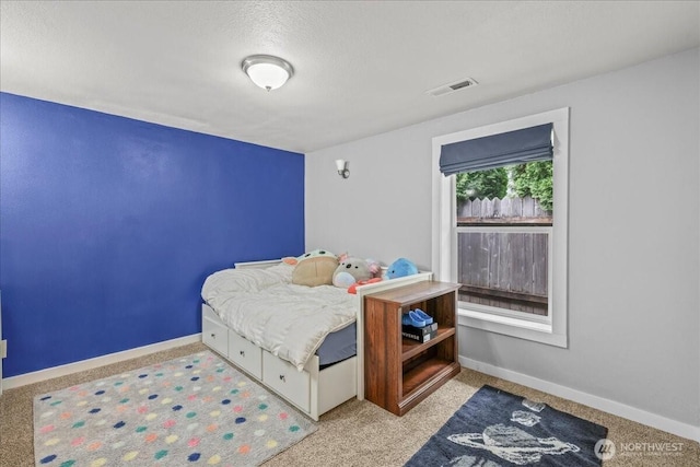 1412 Mcmillan Ave, Sumner, WA 98390 - carpeted bedroom featuring baseboards and a textured ceiling