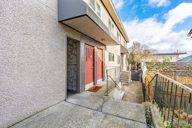 4456 Whitman Ave N, Seattle, WA 98103 - entrance to property with stucco siding and stone siding