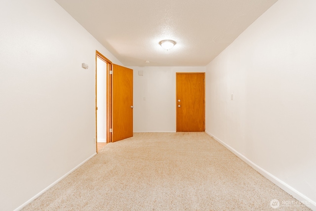 4456 Whitman Ave N, Seattle, WA 98103 - carpeted empty room with a textured ceiling and baseboards
