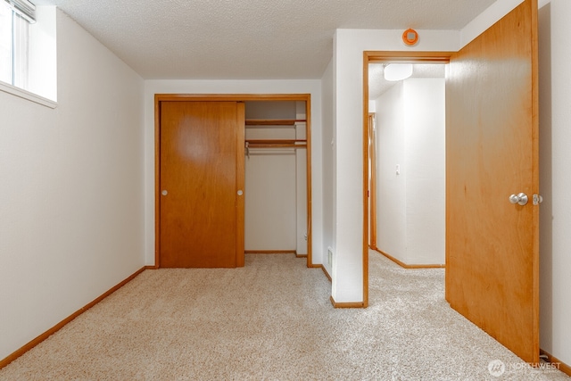 4456 Whitman Ave N, Seattle, WA 98103 - unfurnished bedroom with carpet floors, a closet, and baseboards