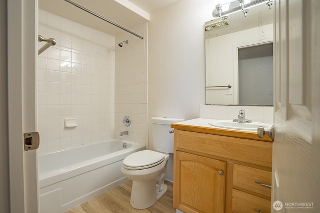 4456 Whitman Ave N, Seattle, WA 98103 - full bath with vanity, toilet, shower / bathtub combination, and wood finished floors