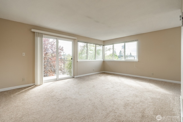 4456 Whitman Ave N, Seattle, WA 98103 - carpeted spare room with baseboards
