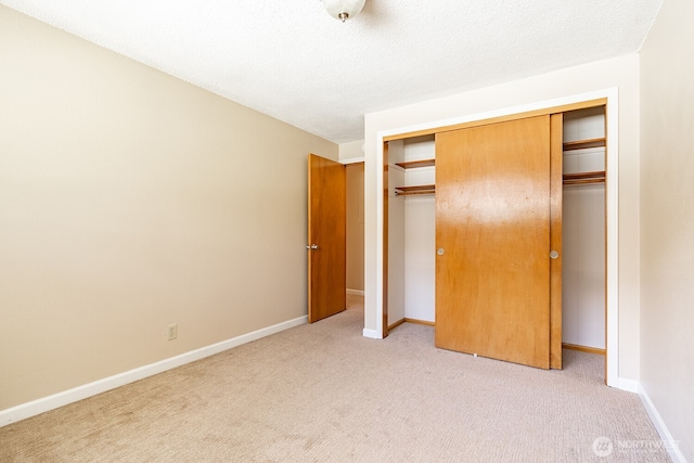 4456 Whitman Ave N, Seattle, WA 98103 - unfurnished bedroom featuring light carpet, a closet, and baseboards