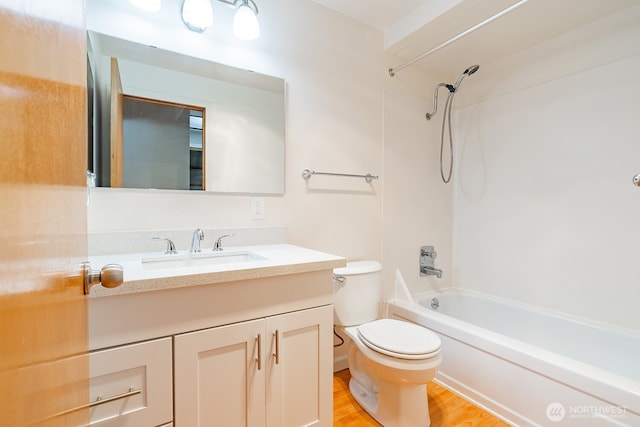 4456 Whitman Ave N, Seattle, WA 98103 - full bathroom with toilet, vanity, shower / bathtub combination, and wood finished floors