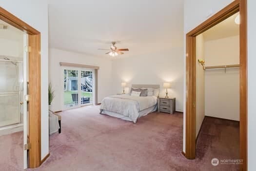 1155 Woods Rd SE, Port Orchard, WA 98366 - carpeted bedroom with ceiling fan, a spacious closet, and a closet