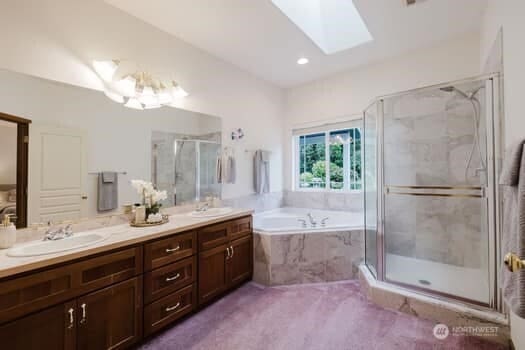 1155 Woods Rd SE, Port Orchard, WA 98366 - bathroom with a skylight, a garden tub, double vanity, and a stall shower