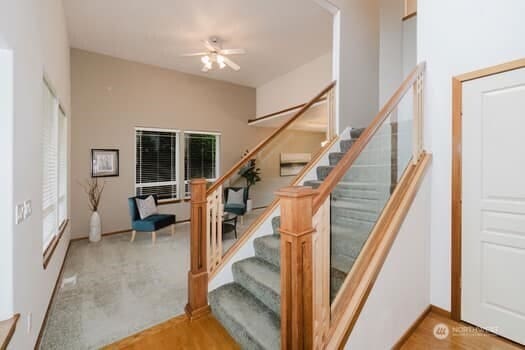 1155 Woods Rd SE, Port Orchard, WA 98366 - staircase with a ceiling fan and wood finished floors