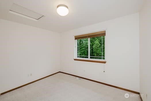 1155 Woods Rd SE, Port Orchard, WA 98366 - carpeted empty room featuring baseboards