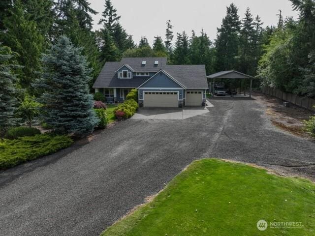 1155 Woods Rd SE, Port Orchard, WA 98366 - view of front facade with a carport, driveway, and a garage