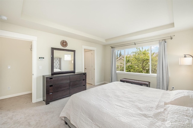 17376 NE 119th Way, Redmond, WA 98052 - bedroom with a tray ceiling, light colored carpet, and baseboards