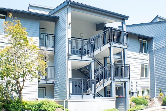 2611 NE 4th St Unit 234, Renton, WA 98056 - view of apartment building / complex with stairway