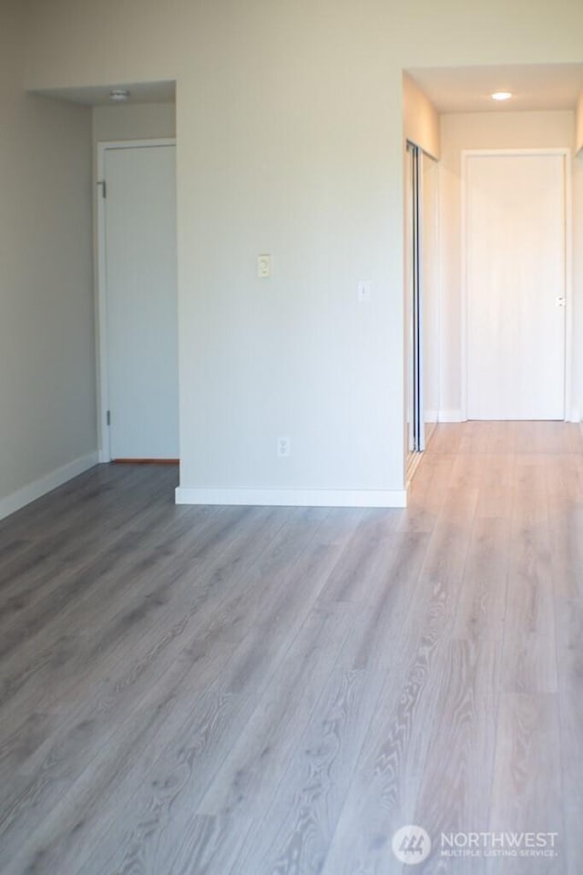 2611 NE 4th St Unit 234, Renton, WA 98056 - unfurnished room featuring wood finished floors, baseboards, and recessed lighting