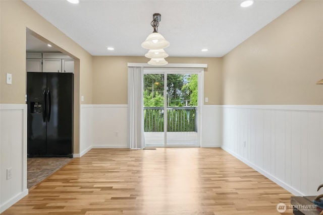 104 Hawthorn Ln, Shelton, WA 98584 - unfurnished dining area with light wood finished floors, a wainscoted wall, and recessed lighting