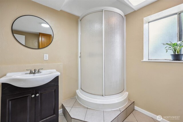 104 Hawthorn Ln, Shelton, WA 98584 - bathroom with vanity, a stall shower, tile patterned flooring, and baseboards